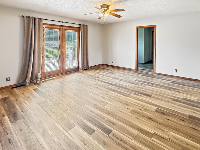 1617 Alexandra Dr, Carthage, MO 64836 - unfurnished room featuring a ceiling fan, light wood finished floors, and a textured ceiling