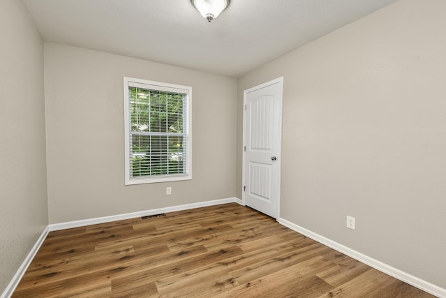 3539 S Walnut Hill Dr, Springfield, MO 65807 - spare room featuring wood finished floors