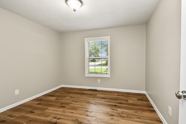 3539 S Walnut Hill Dr, Springfield, MO 65807 - spare room with wood finished floors and baseboards
