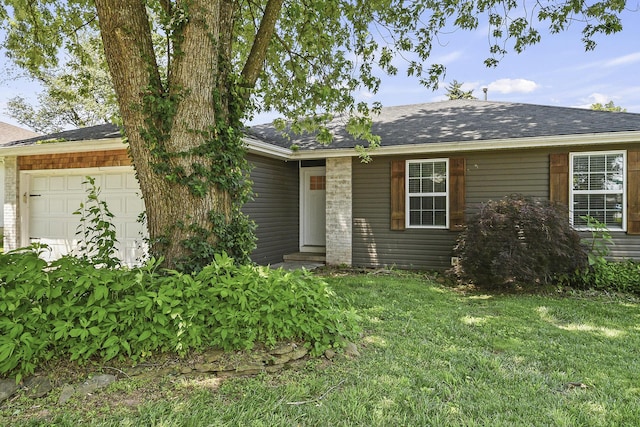 3539 S Walnut Hill Dr, Springfield, MO 65807 - single story home with an attached garage, a shingled roof, and a front yard