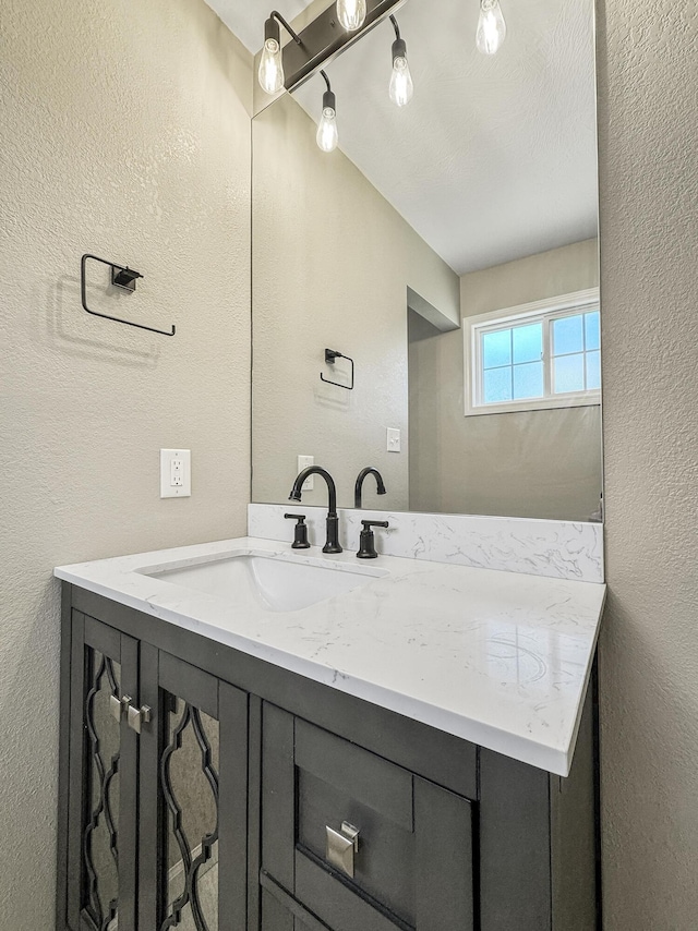3539 S Walnut Hill Dr, Springfield, MO 65807 - bathroom with a textured wall and vanity