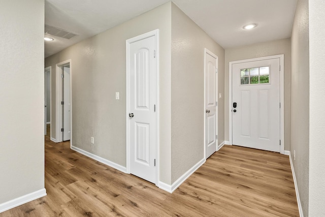 3539 S Walnut Hill Dr, Springfield, MO 65807 - entryway with light wood-type flooring and baseboards
