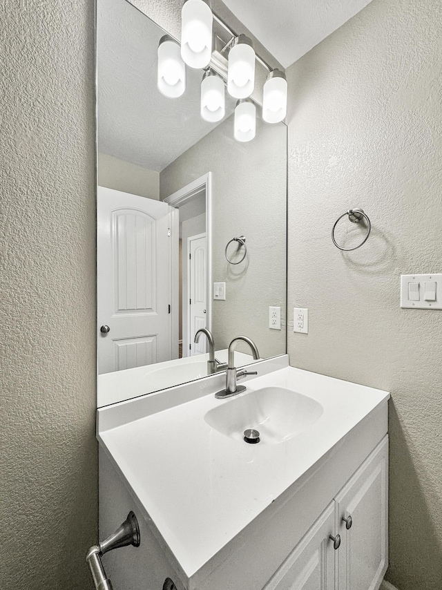 3539 S Walnut Hill Dr, Springfield, MO 65807 - bathroom with a textured wall and vanity
