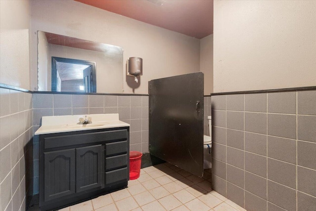 3493 US Highway 160, West Plains, MO 65775 - bathroom with tile walls, vanity, tile patterned flooring, and wainscoting