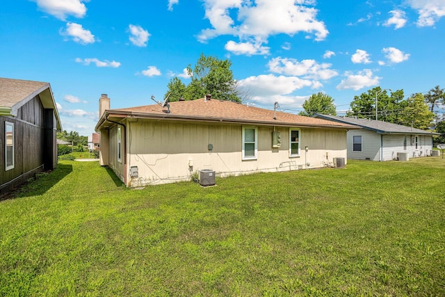 1016 S Lexington Ave, Springfield, MO 65802 - rear view of house with a yard and a chimney