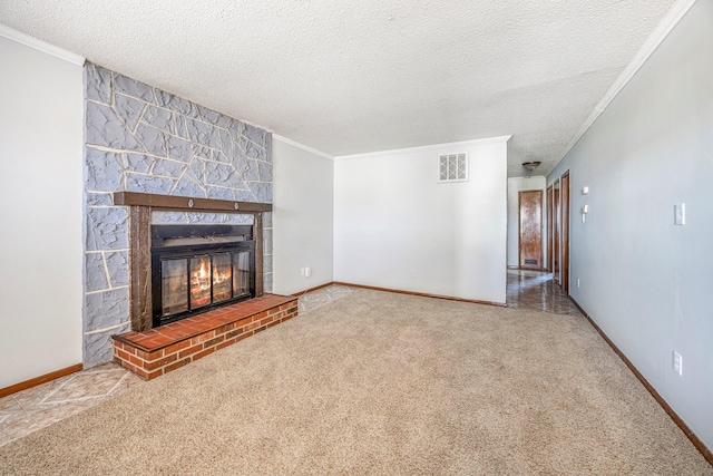 1016 S Lexington Ave, Springfield, MO 65802 - unfurnished living room featuring ornamental molding, a textured ceiling, a large fireplace, and carpet flooring
