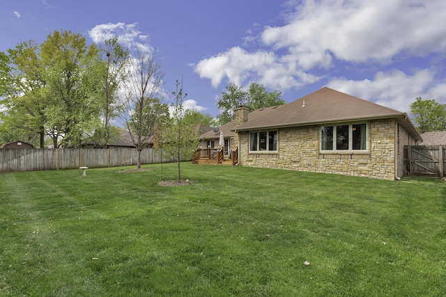 3416 S Barnes Ave, Springfield, MO 65804 - fenced backyard with a wooden deck
