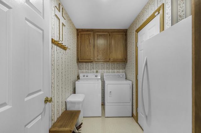 3416 S Barnes Ave, Springfield, MO 65804 - laundry room featuring wallpapered walls, separate washer and dryer, and cabinet space