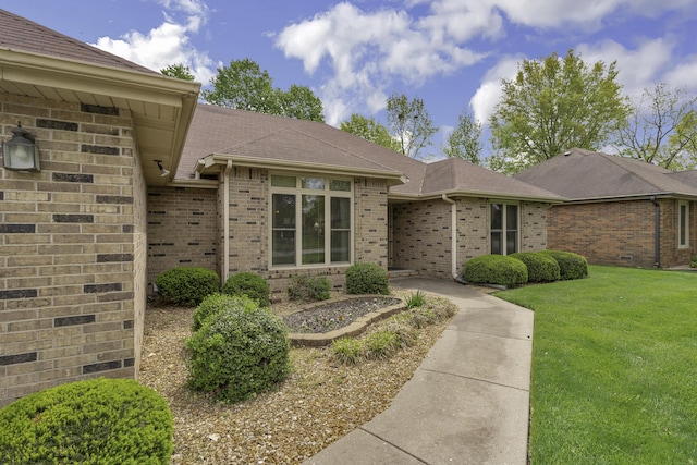 3416 S Barnes Ave, Springfield, MO 65804 - view of front of home featuring brick siding, a front lawn, and a shingled roof