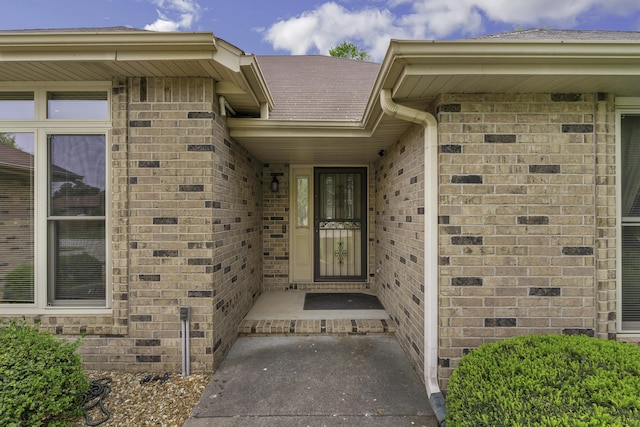 3416 S Barnes Ave, Springfield, MO 65804 - doorway to property featuring brick siding and roof with shingles