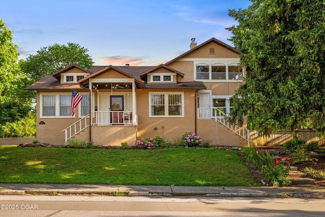 802 Hampton Pl, Joplin, MO 64801 - view of front facade with a front yard, stucco siding, and stairs