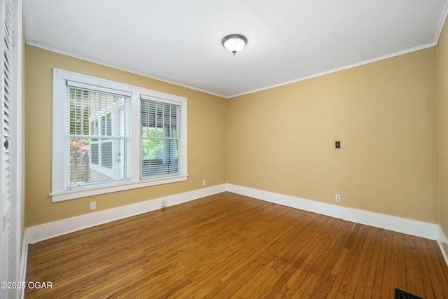 802 Hampton Pl, Joplin, MO 64801 - empty room with hardwood / wood-style flooring and crown molding
