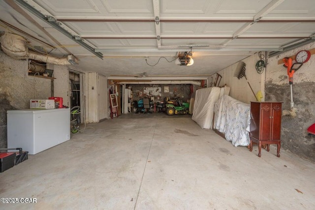 802 Hampton Pl, Joplin, MO 64801 - garage featuring refrigerator and a garage door opener