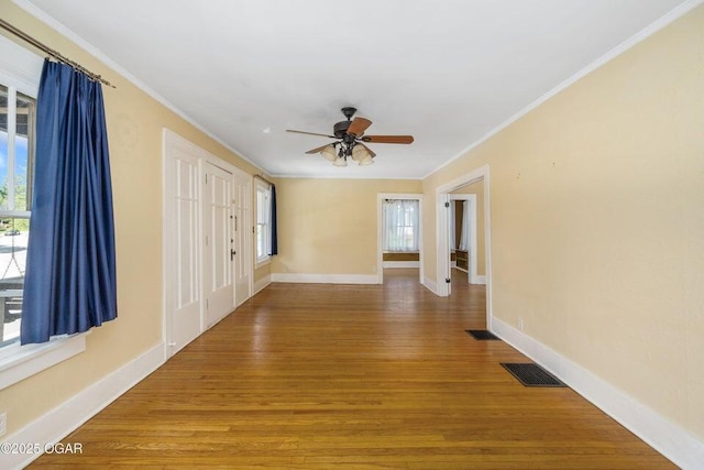 802 Hampton Pl, Joplin, MO 64801 - spare room with plenty of natural light, ceiling fan, wood finished floors, and crown molding