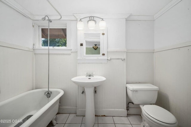 802 Hampton Pl, Joplin, MO 64801 - full bathroom featuring a soaking tub, tile patterned floors, wainscoting, and ornamental molding