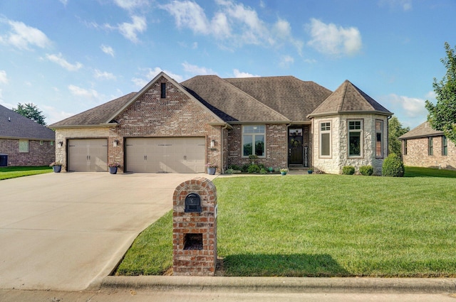 914 W Lorenza Dr, Nixa, MO 65714 - french provincial home with a garage, driveway, a front lawn, and a shingled roof