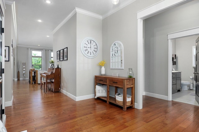 914 W Lorenza Dr, Nixa, MO 65714 - hallway featuring ornamental molding, light wood finished floors, and recessed lighting