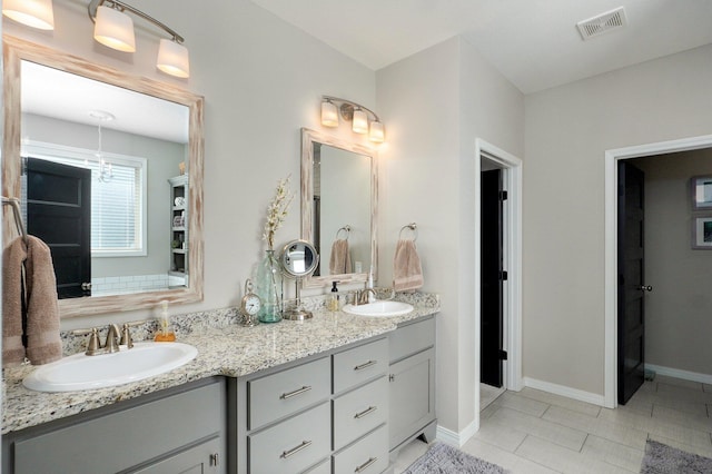 914 W Lorenza Dr, Nixa, MO 65714 - full bath featuring double vanity and tile patterned flooring