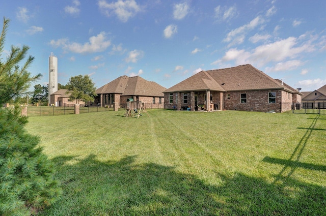 914 W Lorenza Dr, Nixa, MO 65714 - fenced backyard featuring a playground