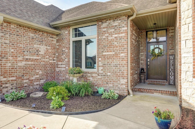 914 W Lorenza Dr, Nixa, MO 65714 - doorway to property featuring a shingled roof and brick siding