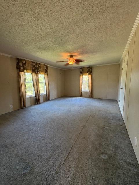 64 Inman Dr, Theodosia, MO 65761 - carpeted spare room featuring a textured ceiling, crown molding, and ceiling fan