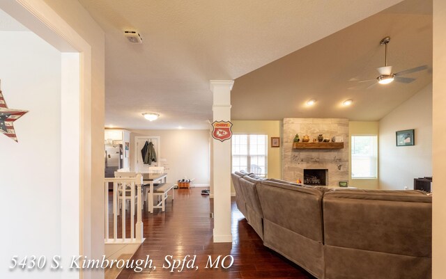 5430 S Kimbrough Ave, Springfield, MO 65810 - living area featuring a large fireplace, dark wood finished floors, and a ceiling fan