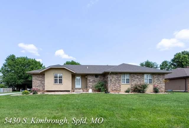 5430 S Kimbrough Ave, Springfield, MO 65810 - ranch-style house featuring a front yard, a shingled roof, and brick siding