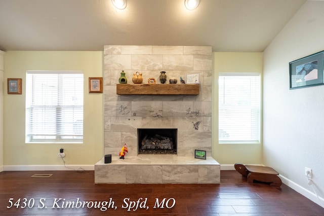 5430 S Kimbrough Ave, Springfield, MO 65810 - living room featuring dark wood-type flooring and a tile fireplace