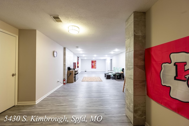 5430 S Kimbrough Ave, Springfield, MO 65810 - hallway featuring wood finished floors and a textured ceiling