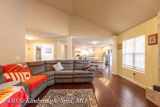 5430 S Kimbrough Ave, Springfield, MO 65810 - living area featuring dark wood-style flooring, high vaulted ceiling, and decorative columns