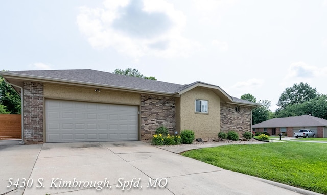5430 S Kimbrough Ave, Springfield, MO 65810 - ranch-style home with driveway, an attached garage, a front lawn, and brick siding