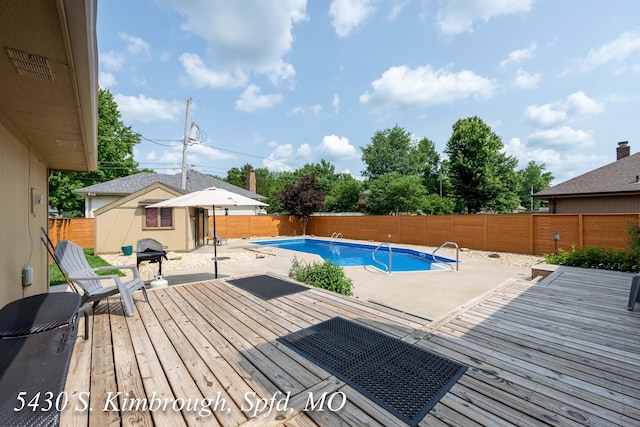 5430 S Kimbrough Ave, Springfield, MO 65810 - view of swimming pool featuring a fenced backyard, a patio area, a wooden deck, and grilling area