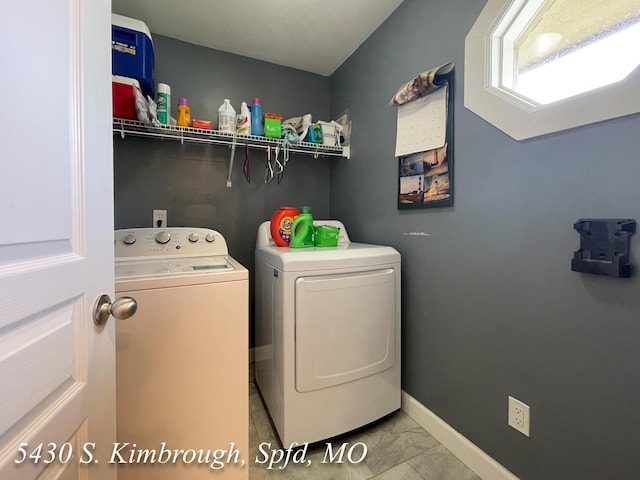5430 S Kimbrough Ave, Springfield, MO 65810 - washroom featuring washing machine and dryer and marble look tiles
