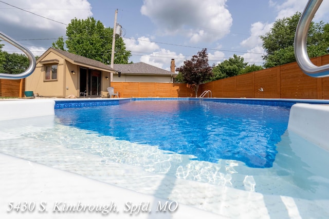 5430 S Kimbrough Ave, Springfield, MO 65810 - view of pool with a fenced backyard and an outdoor structure