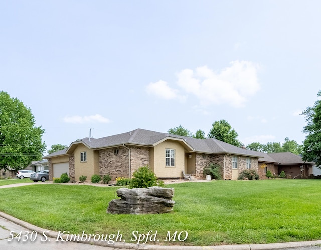 5430 S Kimbrough Ave, Springfield, MO 65810 - ranch-style home featuring a garage, a front lawn, and brick siding