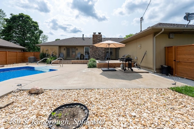 5430 S Kimbrough Ave, Springfield, MO 65810 - view of swimming pool featuring a patio, a fenced backyard, and grilling area