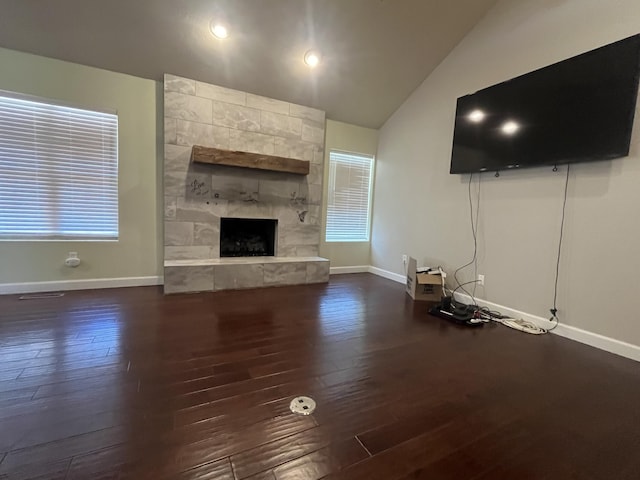 5430 S Kimbrough Ave, Springfield, MO 65810 - unfurnished living room with dark wood-style flooring, lofted ceiling, and a fireplace
