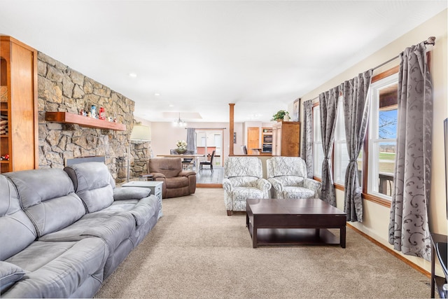 6585 N Farm Rd 61, Walnut Grove, MO 65770 - living area with carpet floors, a chandelier, and a stone fireplace