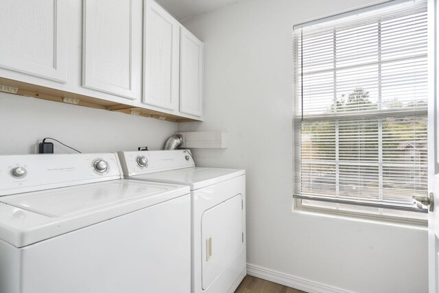 2950 Vineyards Pkwy Unit 5, Branson, MO 65616 - laundry area with washer and clothes dryer, cabinet space, and wood finished floors