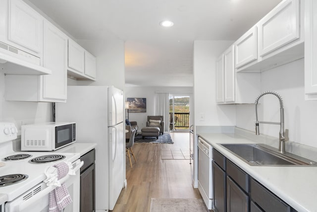 2950 Vineyards Pkwy Unit 5, Branson, MO 65616 - kitchen with white appliances, white cabinetry, light countertops, ventilation hood, and recessed lighting