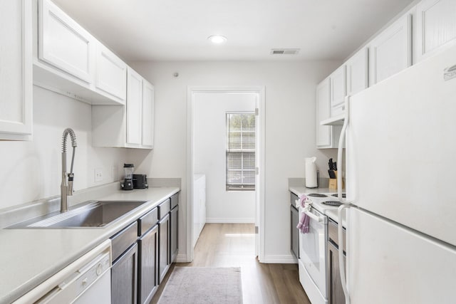 2950 Vineyards Pkwy Unit 5, Branson, MO 65616 - kitchen featuring white appliances, white cabinets, dark wood-style flooring, light countertops, and recessed lighting