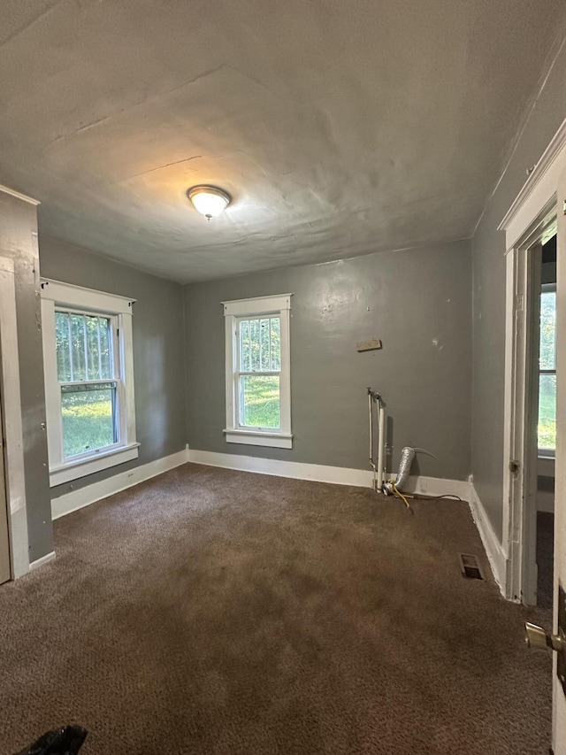 5143 Farm Rd Unit 2000, Pierce City, MO 65723 - unfurnished room featuring baseboards and dark carpet
