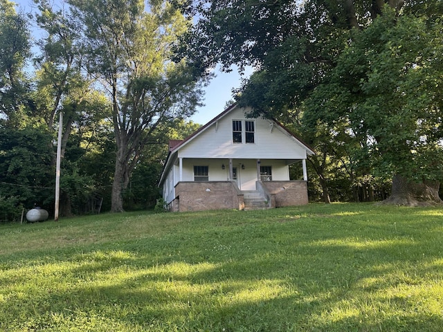 5143 Farm Rd Unit 2000, Pierce City, MO 65723 - view of front facade with covered porch and a front yard