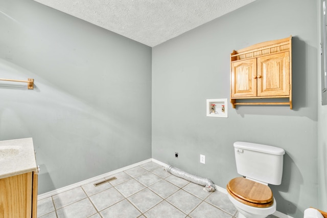 784 S 17th St, Ozark, MO 65721 - half bathroom with vanity, tile patterned flooring, and a textured ceiling