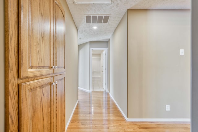 784 S 17th St, Ozark, MO 65721 - hall featuring a textured ceiling, light wood finished floors, and recessed lighting