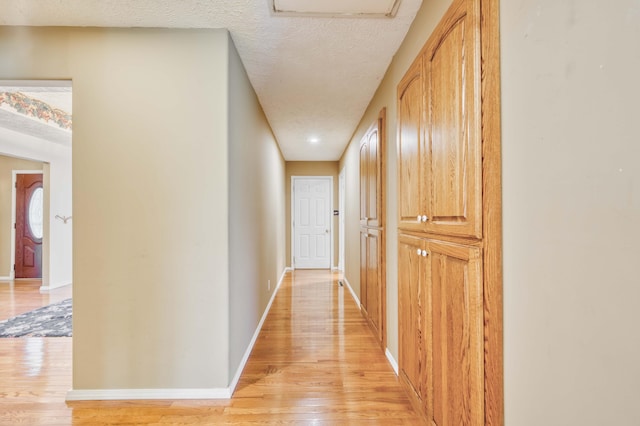 784 S 17th St, Ozark, MO 65721 - hallway with light wood finished floors and a textured ceiling