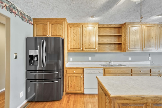 784 S 17th St, Ozark, MO 65721 - kitchen with stainless steel refrigerator with ice dispenser, white dishwasher, light wood-style floors, light countertops, and a textured ceiling