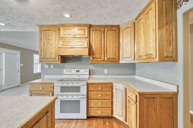 784 S 17th St, Ozark, MO 65721 - kitchen featuring double oven range, a textured ceiling, light countertops, premium range hood, and light wood-type flooring