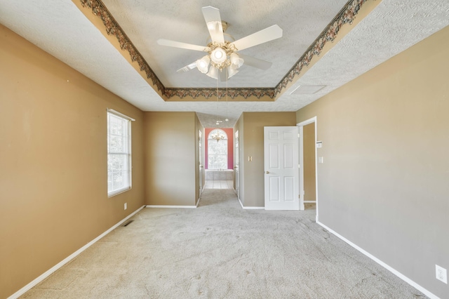 784 S 17th St, Ozark, MO 65721 - unfurnished bedroom with carpet flooring, a textured ceiling, connected bathroom, and a raised ceiling