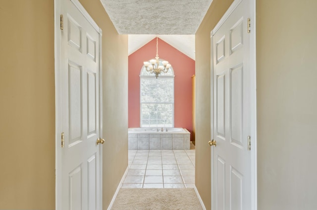 784 S 17th St, Ozark, MO 65721 - corridor with a chandelier, light tile patterned floors, and lofted ceiling
